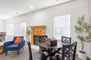 a living room with a table and chairs at Spacious 6 bed Bentonville House, Sleeps 12, Smart TVs, Wi-Fi in Bentonville