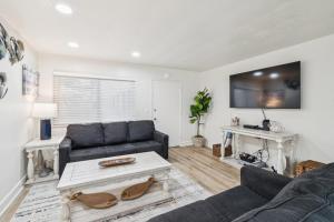 a living room with a couch and a table at 2 Bed Beach Condo #125 in Carpinteria