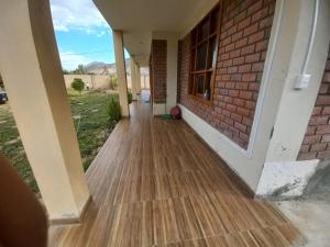 a hallway of a house with a wooden floor at El Refugio Escondido in Caraz