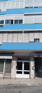 a blue building with white doors and windows at CarriCHe 2 in Lisbon