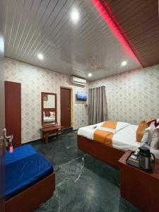Ένα ή περισσότερα κρεβάτια σε δωμάτιο στο Hotel O Utsav +33 φωτογραφίες