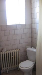 a bathroom with a toilet and a window at Chalupa Pribylina in Pribylina +8 photos