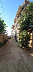 an empty street in front of a building at CALM STAYs in Kampala
