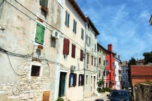 a car parked on a street next to a building at Studio Biritin in Rovinj