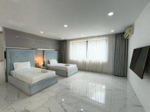 Ένα ή περισσότερα κρεβάτια σε δωμάτιο στο TYb06 芭提雅北歐風格六臥室別墅 +26 φωτογραφίες