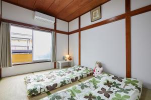 Katil atau katil-katil dalam bilik di Sweet House東池袋