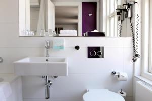 Koupelna v ubytování Absalon Hotel