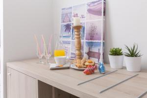 a table with a candle and other items on it at 12 Olympian Gods in Platamonas +29 photos