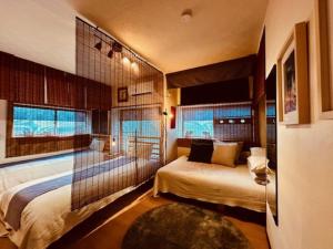 Postel nebo postele na pokoji v ubytování ViVo銀座