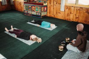 a group of people laying on the floor in a room at Sherpa Panorama Hotels in Khumjung