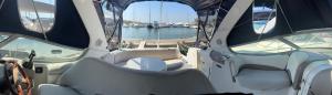 a boat sitting in a marina with a view of the water at bateaux à quai Porquerolles in Hyères