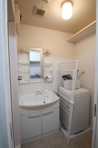 Phòng tắm tại オンブラージュ九203