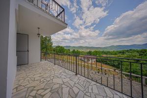a balcony with a view of the mountains at Villa High Point in Pravets