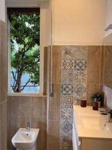 a bathroom with a sink and a window at Villa Anna Francavilla al Mare in Francavilla al Mare