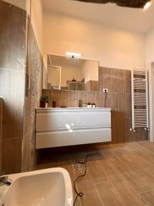a bathroom with a white sink and a mirror at Villa Anna Francavilla al Mare in Francavilla al Mare +22 photos