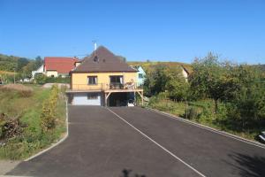 a house on the side of a road at le chemin du meunier in Riquewihr