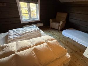 En eller flere senge i et værelse på Great cabin with gorgeous mountain views