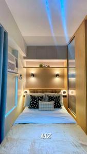 a bedroom with a king sized bed in a room at Cozy Corner Haven near Venice Grand Canal Mall in Manila
