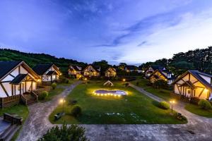 an aerial view of a resort yard at night at Jeju Mungmung Place Dog Pension in Jeju +37 photos