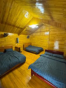 Ένα ή περισσότερα κρεβάτια σε δωμάτιο στο Mama Sa Trekking & Homestay Sapa