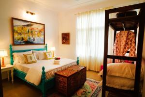 a bedroom with a bed and a window and a bed sidx sidx sidx at Met Luxe Galleria in Jaipur