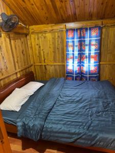 Ένα ή περισσότερα κρεβάτια σε δωμάτιο στο Mama Sa Trekking & Homestay Sapa