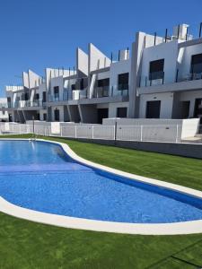 an external view of a building with a swimming pool at Cosy Casa New penthouse in San Miguel de Salinas
