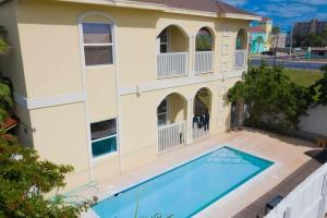 an overhead view of a house with a swimming pool at Clean Pool Walk to Beach - Pet Ok - Ground Floor in South Padre Island