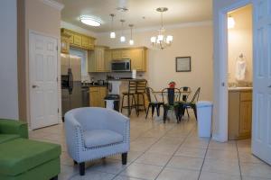 a kitchen and dining room with a table and chairs at Clean Pool Walk to Beach - Pet Ok - Ground Floor in South Padre Island