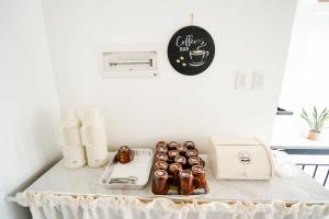 a table with a tray of donuts on it at MGM Tourist Inn in Tagbilaran City +4 photos
