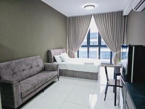 a living room with a couch and a bed at Gen Majestic Residence Kuala Lumpur in Kuala Lumpur +68 photos