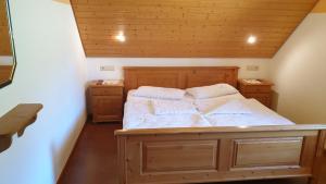a bedroom with a large bed in a attic at Appartement In Wittenschwand in Wittenschwand