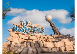 a sign for the water world at the disneyland resort at Yas Vista 2BR - Spacious Apartment with Pool & Balcony Near Yas Mall & Marina in Abu Dhabi