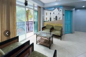 a waiting room with two couches and a table at Hotel Le Carmen in Cebu City