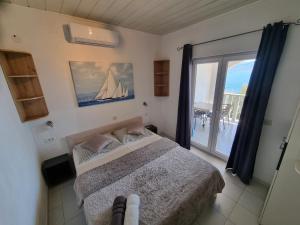a bedroom with a bed with a view of the ocean at Villa Ana in Slatine +74 photos