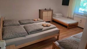 Un ou plusieurs lits dans un hébergement de l'établissement Mieszkanie na wyłączność