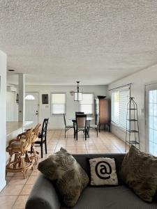 a living room with a couch and a table at Waterfront 2-BR Home in Providenciales in Providenciales
