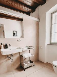a bathroom with a sink and a mirror at Schwarzes Haus in Ybbsitz