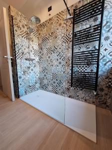a room with a wall with a mural of flowers at Casa Nico in Dossobuono +23 photos