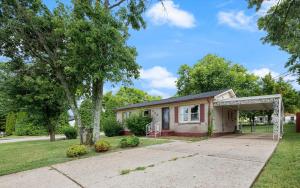 a small house with a garage in a yard at Cozy Franklin Hideaway - For 5 in Franklin