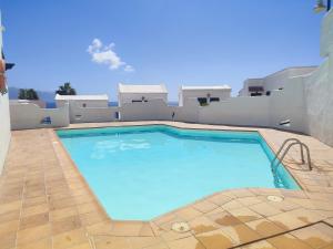 a large blue swimming pool in a yard at Vista Mar Sardina in Gáldar