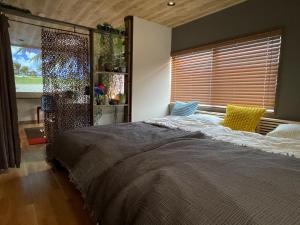 Una cama o camas en una habitación de Green Villa KUROSAKI