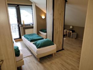 Ένα ή περισσότερα κρεβάτια σε δωμάτιο στο Familiehuis Dolve