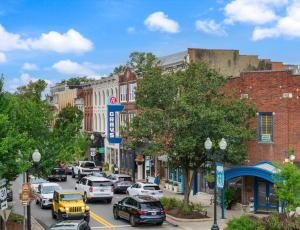a busy city street with cars parked on the street at Carters Court Grand Escape in Franklin