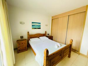 a bedroom with a large bed and two night stands at Suíte Deluxe Soares in Prainha +25 photos