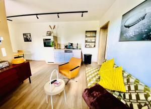 a living room with a couch and a table at Joe's Home Naumburg -modern,vintage Apartment in Naumburg