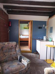 a living room with a couch and a kitchen at mart INN in Euscheid