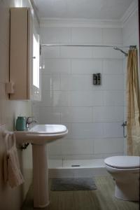 a bathroom with a sink and a toilet at Hostel Banana Surf House in Los Cristianos +44 photos