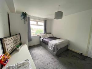 Ένα ή περισσότερα κρεβάτια σε δωμάτιο στο Home sweet home