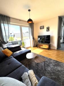 Posezení v ubytování Gehobenes Wohnen mit Balkon, Parkplatz und keine 10 Minuten in die City